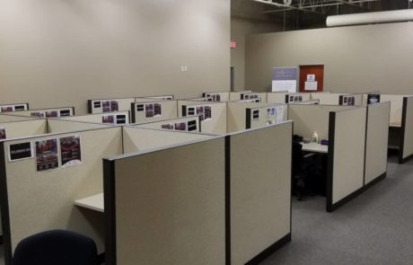 multiple office cubicles with office chairs