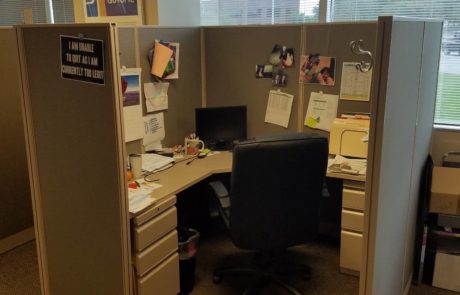 Office cubicle setting with high back office chair