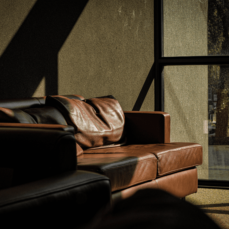 couches in a well-lit common space lobby